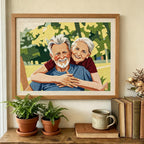 Framed embroidered portrait of an elderly couple on a shelf with plants and books.
