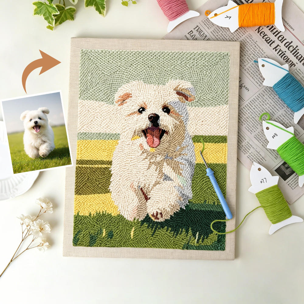 Embroidery of a dog on fabric with embroidery tools and a photo of a real dog.