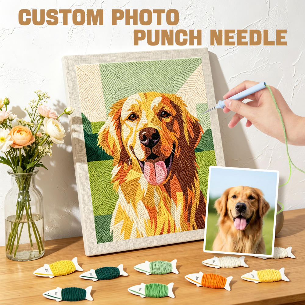 Custom photo punch needle craft with a completed needlepoint of a dog, surrounded by materials and a hand holding a needle.