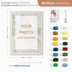 Embroidery kit with frame, thread colors, and needle on a white background