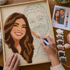 Couple with their custom punch needle portrait made from their favorite photo